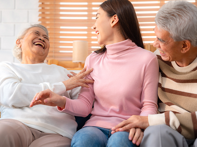 news_0000_three-people-laughing-together-on-a-couch-2026-01-05-00-06-12-utc